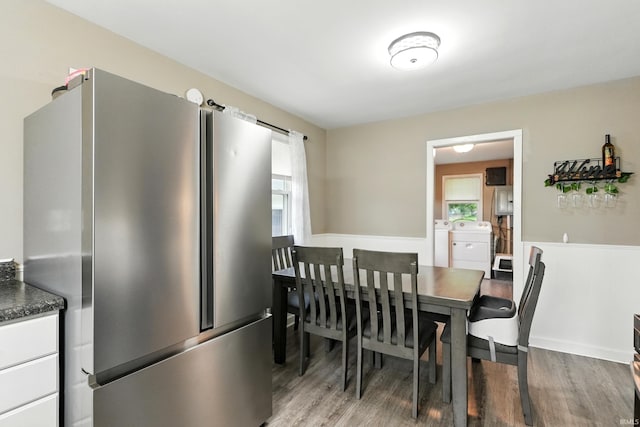 9014 Muldoon Rd, Fort Wayne, IN 46819 - dining space featuring wood finished floors and washer and clothes dryer