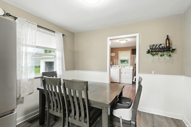 9014 Muldoon Rd, Fort Wayne, IN 46819 - dining area with washer and clothes dryer and wood finished floors