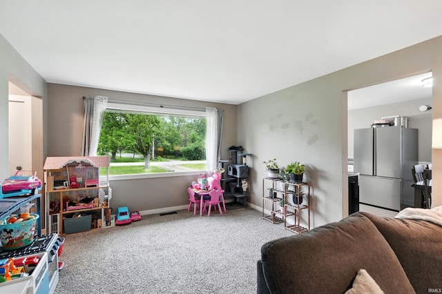9014 Muldoon Rd, Fort Wayne, IN 46819 - recreation room featuring baseboards and carpet flooring