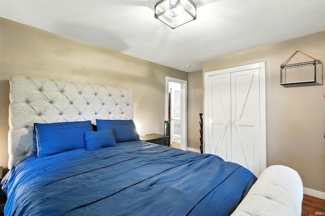 9014 Muldoon Rd, Fort Wayne, IN 46819 - bedroom with baseboards, a closet, and wood finished floors