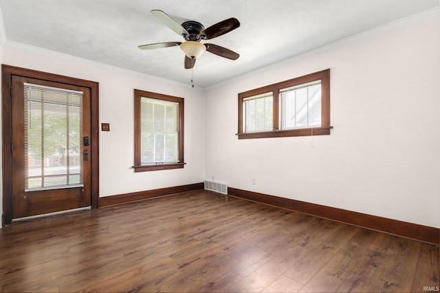 1218 S Twyckenham Dr, South Bend, IN 46615 - empty room featuring baseboards, dark wood-style flooring, crown molding, and ceiling fan