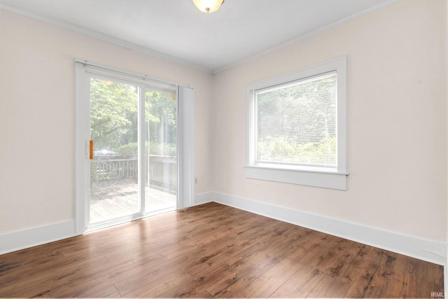 1218 S Twyckenham Dr, South Bend, IN 46615 - spare room featuring crown molding, wood finished floors, and baseboards