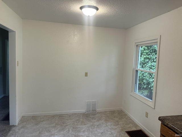 3324 Alexander St, Fort Wayne, IN 46806 - empty room featuring a textured ceiling and baseboards