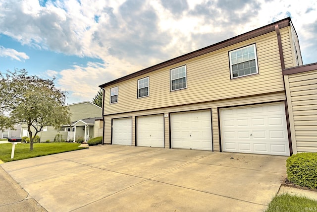 3208 Hanover Dr Unit 17-D, Lafayette, IN 47909 - view of front of house featuring driveway and a garage
