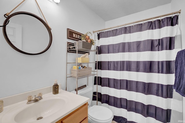 9617 S Lake Ridge Dr Unit 4, Bloomington, IN 47401 - full bathroom with toilet, vanity, curtained shower, and a textured ceiling