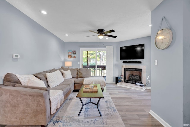 9617 S Lake Ridge Dr Unit 4, Bloomington, IN 47401 - living area featuring a ceiling fan, light wood-style floors, baseboards, a fireplace, and recessed lighting