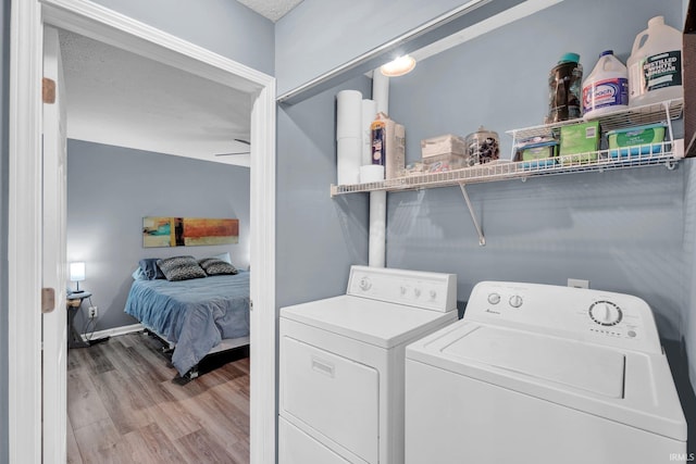 9617 S Lake Ridge Dr Unit 4, Bloomington, IN 47401 - washroom featuring washing machine and dryer and wood finished floors
