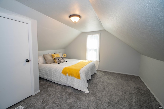 57005 Southshore Dr, Osceola, IN 46561 - carpeted bedroom with lofted ceiling, baseboards, and a textured ceiling