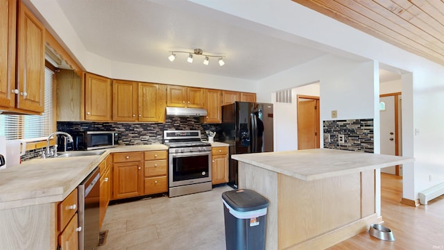 7333 W Newton Stewart Rd, Taswell, IN 47175 - kitchen featuring stainless steel appliances, under cabinet range hood, light countertops, and tasteful backsplash