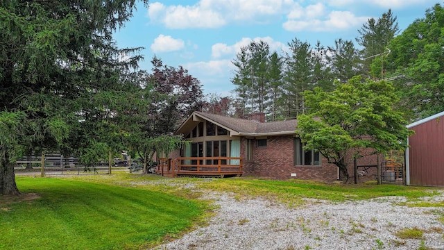 7333 W Newton Stewart Rd, Taswell, IN 47175 - view of home's exterior featuring brick siding, a deck, and a chimney