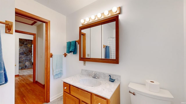 7333 W Newton Stewart Rd, Taswell, IN 47175 - full bath featuring vanity, toilet, wood finished floors, and baseboards