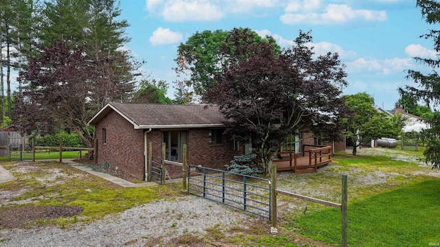 7333 W Newton Stewart Rd, Taswell, IN 47175 - back of house with brick siding, a wooden deck, and a shingled roof