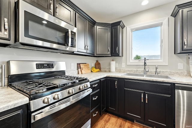1308 Hideaway Dr, Auburn, IN 46706 - kitchen featuring stainless steel appliances, a sink, light countertops, and recessed lighting