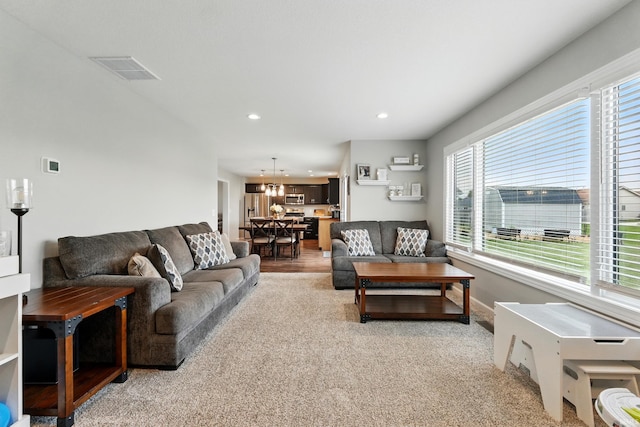 1308 Hideaway Dr, Auburn, IN 46706 - living area featuring plenty of natural light, recessed lighting, light carpet, and baseboards