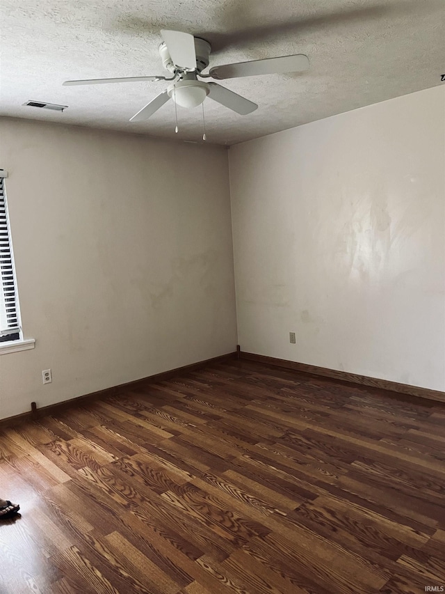 336 Wilmington Ct Unit C, Bloomington, IN 47401 - spare room featuring dark wood finished floors, a ceiling fan, a textured ceiling, and baseboards