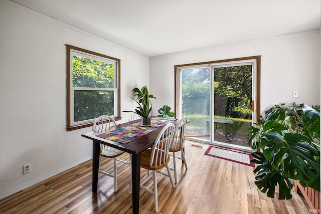 1330 Helmen Dr, South Bend, IN 46615 - dining area featuring healthy amount of natural light, wood finished floors, crown molding, and baseboards