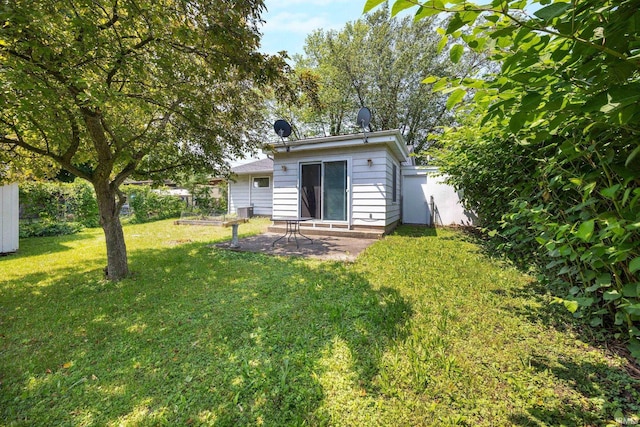 1330 Helmen Dr, South Bend, IN 46615 - back of property with a patio area and a yard