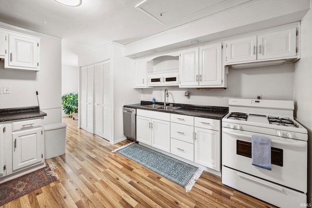 1330 Helmen Dr, South Bend, IN 46615 - kitchen with white range with gas stovetop, a sink, dishwasher, light wood finished floors, and white cabinetry
