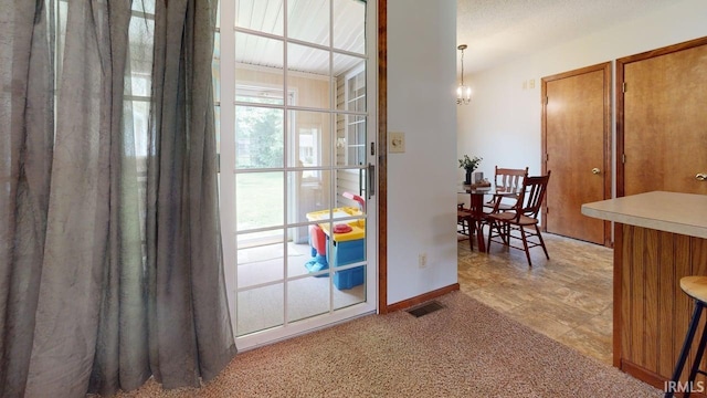 12 Vicki Dr, Vincennes, IN 47591 - doorway to outside featuring baseboards