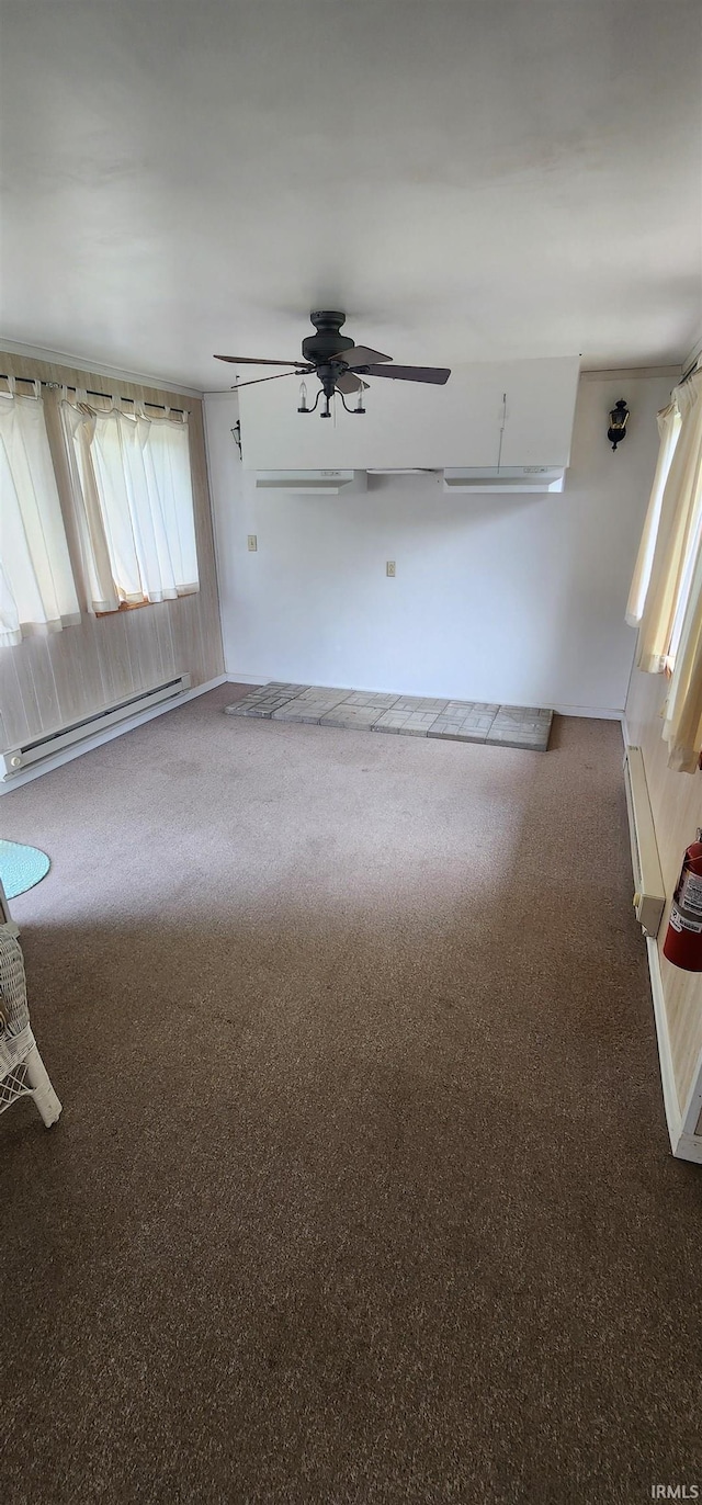 12 Vicki Dr, Vincennes, IN 47591 - spare room featuring a baseboard radiator, carpet, and ceiling fan