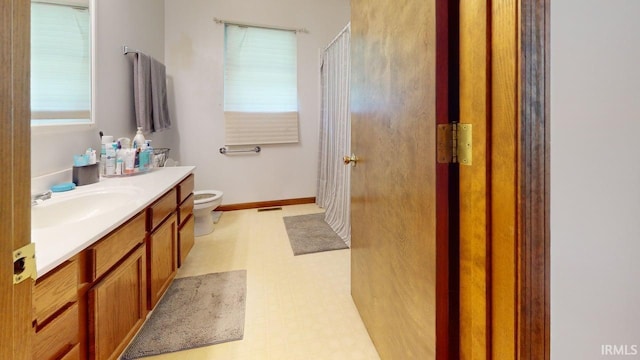 12 Vicki Dr, Vincennes, IN 47591 - bathroom with vanity, toilet, tile patterned floors, and curtained shower