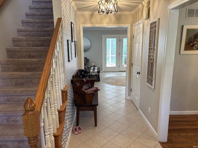 39 Hannah Ln, Jasper, IN 47546 - foyer with stairway, light tile patterned floors, ornamental molding, and baseboards