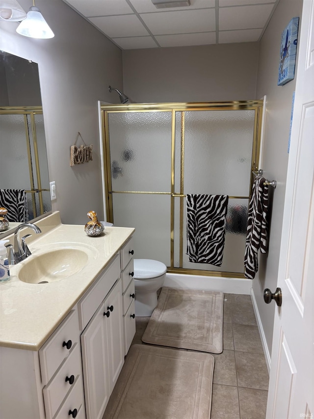 39 Hannah Ln, Jasper, IN 47546 - bathroom with vanity, a paneled ceiling, a stall shower, toilet, and tile patterned floors