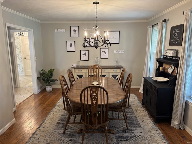 39 Hannah Ln, Jasper, IN 47546 - dining space with dark wood-style flooring, a chandelier, baseboards, and ornamental molding