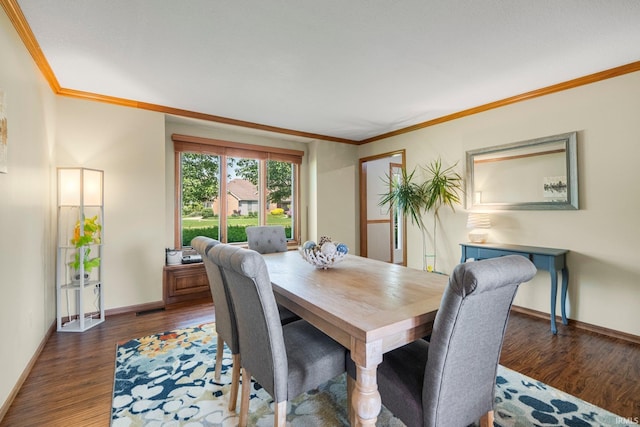 521 Glenmoor Dr, Fort Wayne, IN 46804 - dining area featuring crown molding, baseboards, and dark wood-style floors
