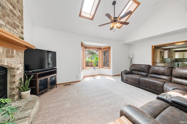 521 Glenmoor Dr, Fort Wayne, IN 46804 - living area featuring high vaulted ceiling, carpet flooring, a ceiling fan, baseboards, and a brick fireplace