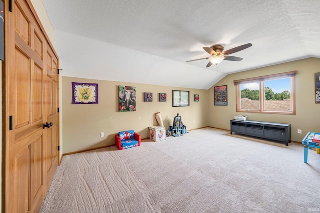 521 Glenmoor Dr, Fort Wayne, IN 46804 - game room featuring vaulted ceiling, light carpet, a ceiling fan, a textured ceiling, and baseboards