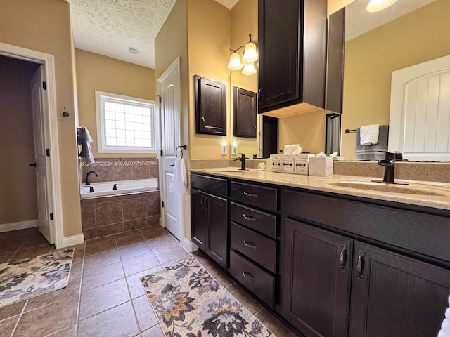 4691 Flagship Ln, Lafayette, IN 47909 - full bath featuring double vanity, a bath, tile patterned floors, a textured ceiling, and baseboards