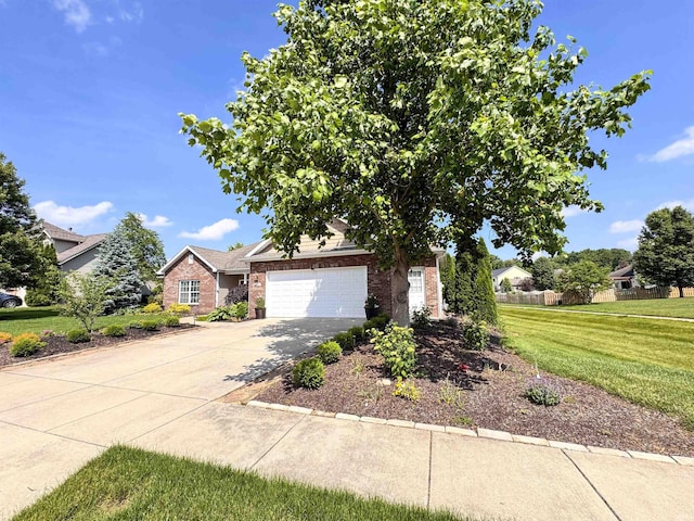 4691 Flagship Ln, Lafayette, IN 47909 - obstructed view of property featuring brick siding, a front yard, driveway, and a garage
