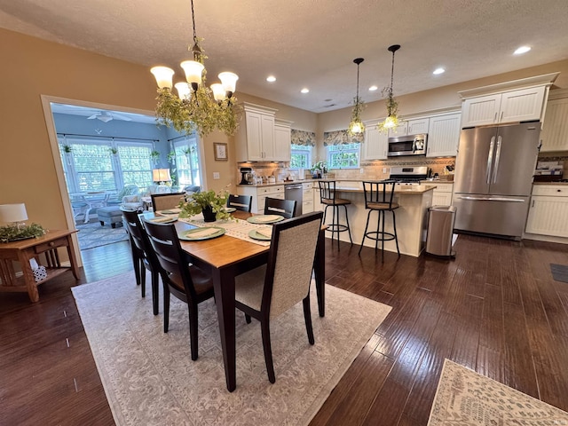 4691 Flagship Ln, Lafayette, IN 47909 - dining area featuring a textured ceiling, recessed lighting, dark wood-type flooring, a chandelier, and a ceiling fan