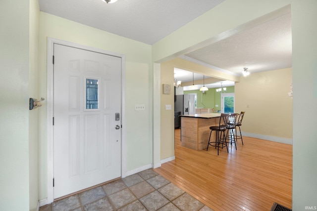 2890 W 400 N, Columbia City, IN 46725 - foyer entrance featuring a textured ceiling and light wood-style flooring