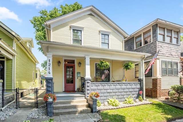 1214 W Jefferson Blvd, Fort Wayne, IN 46802 - view of front of home with a gate and a porch