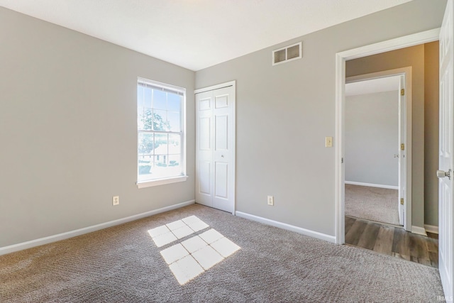 1817 N Elmer St, South Bend, IN 46628 - unfurnished bedroom featuring carpet floors and a closet