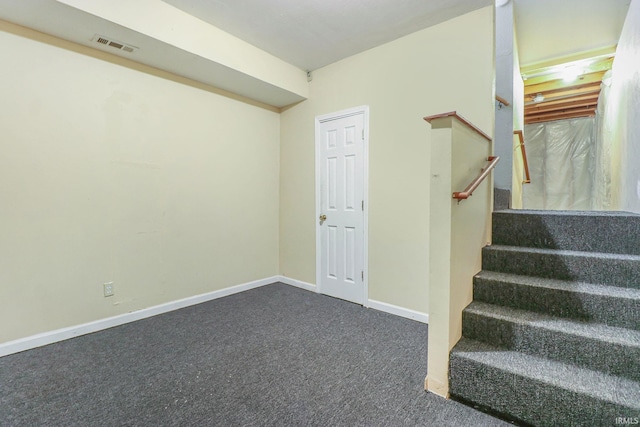 1817 N Elmer St, South Bend, IN 46628 - basement with dark colored carpet and stairway