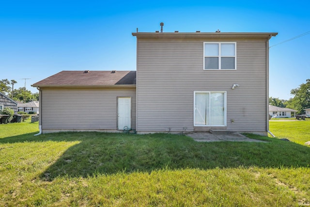 1817 N Elmer St, South Bend, IN 46628 - rear view of house featuring a lawn