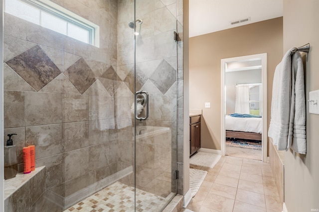 319 Pistoia Cv, Fort Wayne, IN 46845 - ensuite bathroom with a shower stall, vanity, and tile patterned floors