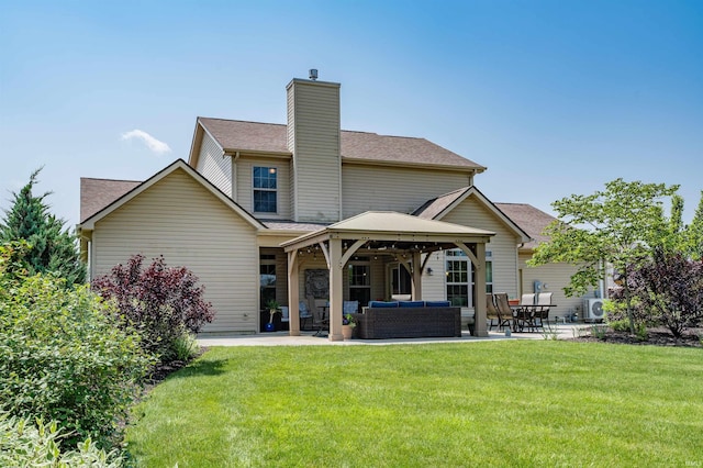 319 Pistoia Cv, Fort Wayne, IN 46845 - back of property with outdoor lounge area, a gazebo, a patio area, a chimney, and a yard