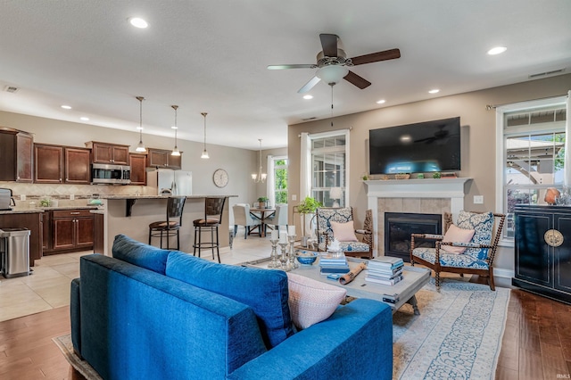 319 Pistoia Cv, Fort Wayne, IN 46845 - living area with plenty of natural light, ceiling fan, light wood finished floors, and recessed lighting