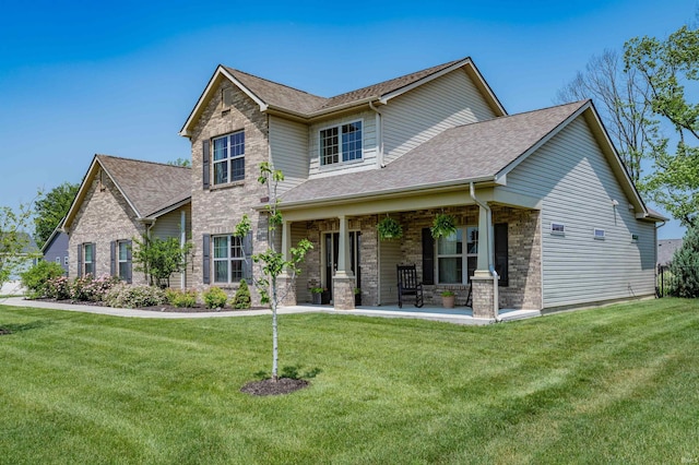 319 Pistoia Cv, Fort Wayne, IN 46845 - craftsman inspired home featuring a front yard, a shingled roof, and brick siding