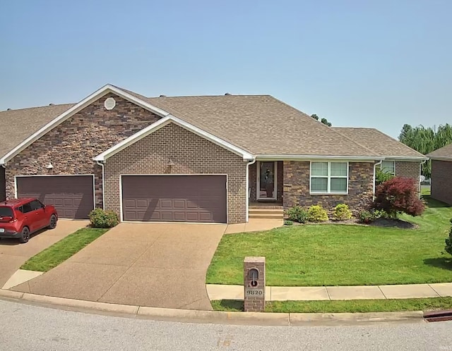 9820 Arbor Lake Dr, Newburgh, IN 47630 - view of front facade featuring a garage, concrete driveway, a front lawn, and stone siding