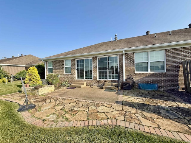 9820 Arbor Lake Dr, Newburgh, IN 47630 - rear view of property featuring entry steps, brick siding, a patio, and roof with shingles