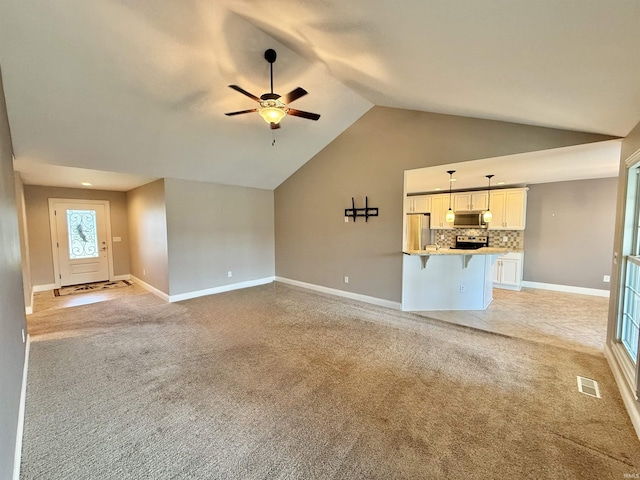9820 Arbor Lake Dr, Newburgh, IN 47630 - unfurnished living room with vaulted ceiling, ceiling fan, and light carpet
