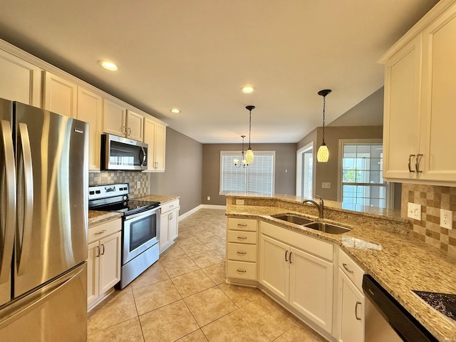 9820 Arbor Lake Dr, Newburgh, IN 47630 - kitchen with stainless steel appliances, recessed lighting, light tile patterned flooring, backsplash, and hanging light fixtures