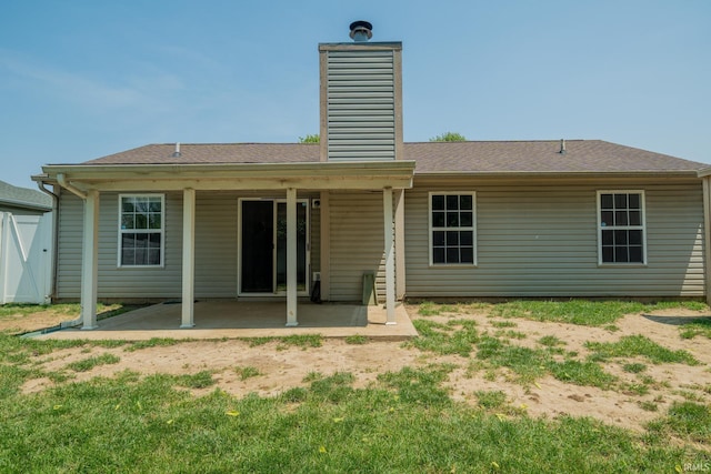 2645 Wynterpointe Ct, Kokomo, IN 46901 - back of house featuring a patio and a chimney