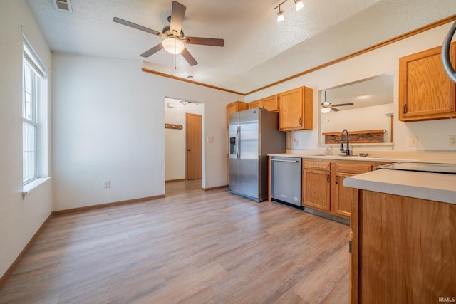 2645 Wynterpointe Ct, Kokomo, IN 46901 - kitchen with appliances with stainless steel finishes, a ceiling fan, plenty of natural light, light countertops, and a textured ceiling