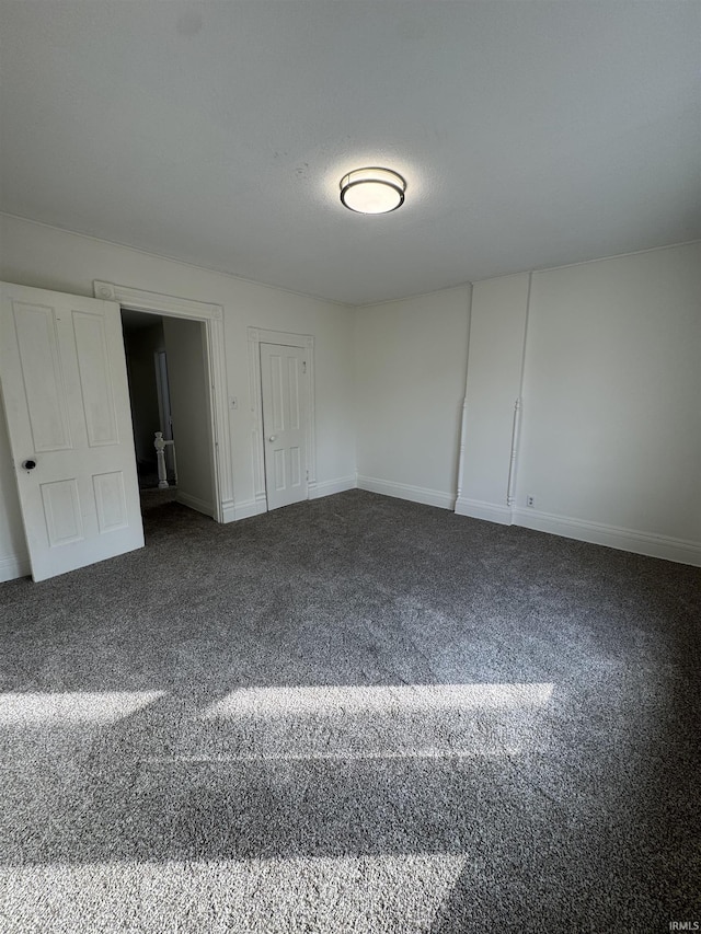 241 W Tipton St, Huntington, IN 46750 - unfurnished bedroom featuring carpet and a closet
